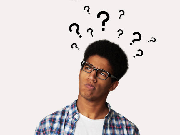 confused afro guy has too many questions - incerteza imagens e fotografias de stock