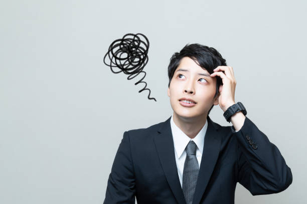Confused young asian businessman. Confused young asian businessman. worried man funny stock pictures, royalty-free photos & images
