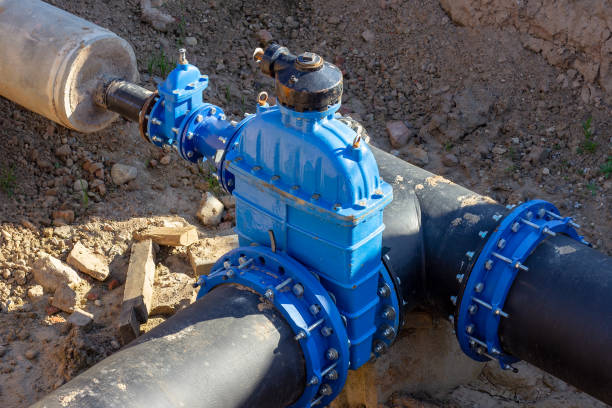 Connection of the construction of main city water blue supply pipeline. stock photo