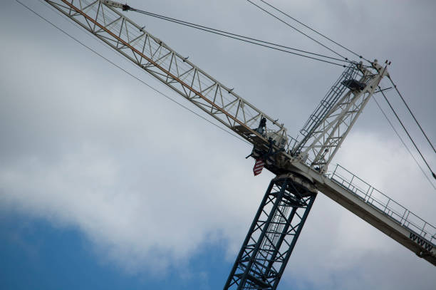 construction crane, long arm pointing up. stock photo