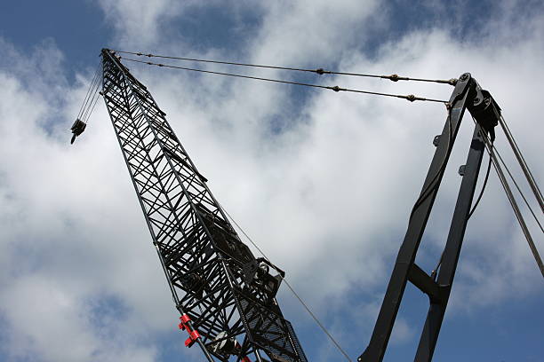 Construction Crane Construction cranes boom and steel cables. crane boom stock pictures, royalty-free photos & images
