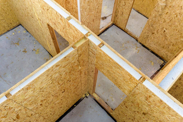 Construction of new and modern modular house. Walls made from composite wooden sip panels with styrofoam insulation inside. Building new frame of energy efficient home concept. Construction of new and modern modular house. Walls made from composite wooden sip panels with styrofoam insulation inside. Building new frame of energy efficient home concept. prefabricated building stock pictures, royalty-free photos & images
