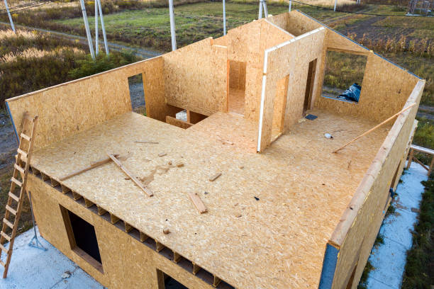 Construction of new and modern modular house. Walls made from composite wooden sip panels with styrofoam insulation inside. Building new frame of energy efficient home concept. stock photo