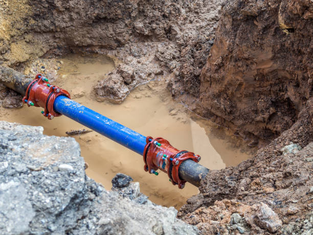 Construction site water pipe Construction site water pipe Burst Pipe stock pictures, royalty-free photos & images