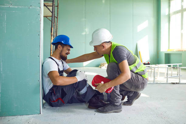 Construction worker accident with a construction worker. Construction worker accident with a construction worker. First aid for injury at work. physical injury stock pictures, royalty-free photos & images