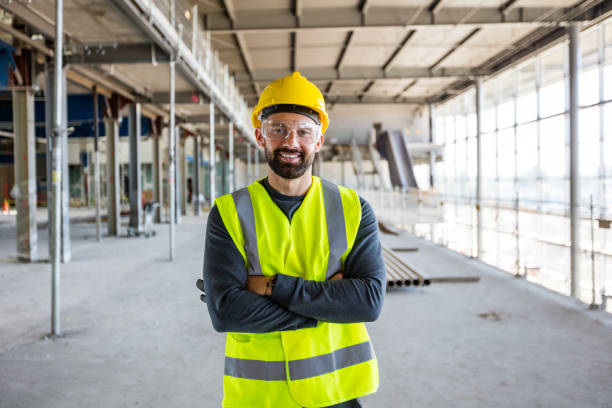 Construction worker at an indoor construction site stock photo