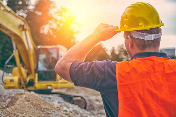 Construction Worker Earth Digger Driver at construction site construction worker stock pictures, royalty-free photos & images