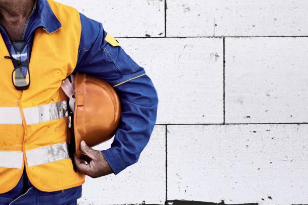 Construction Worker With Hi-Visibility Safety Jacket and Hard Hat stock photo