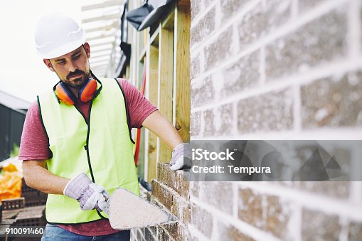 istock Construction workers in Australian in building site working and doing tasks. 910091460