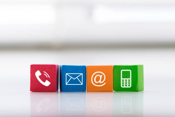 Contact us concept with colorful block symbol telephone, mail, address and mobile phone. stock photo