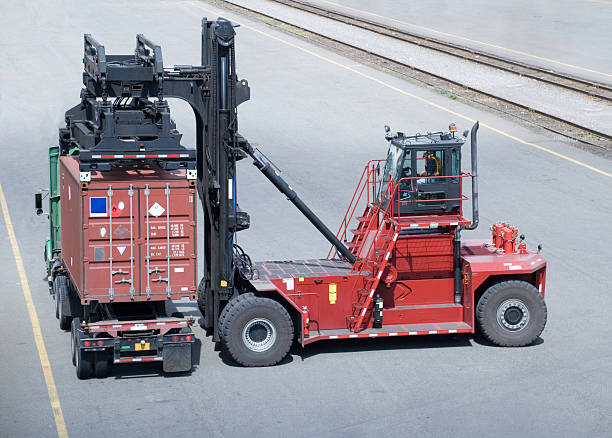 Container Being Loaded On A Truck stock photo