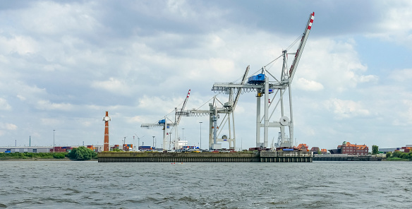 Container port in Hamburg, a city in Northern Germany at summer time