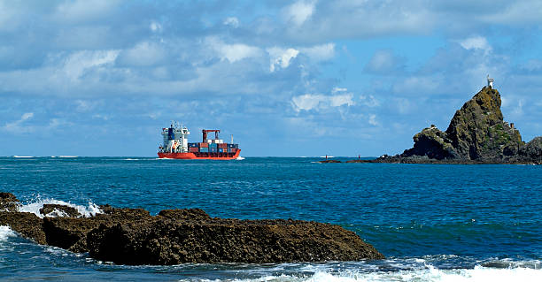 Container ship, Manukau Heads North Island New Zealand stock photo