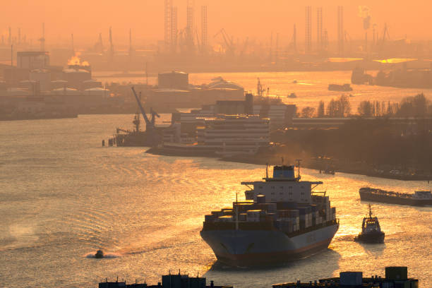 Container ship Rotterdam Port sunset stock photo