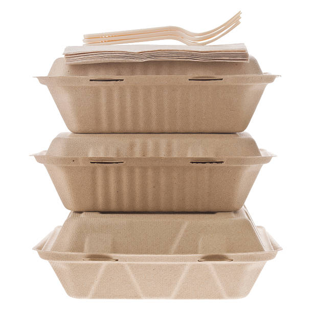 Containers To Go "A close up shot of three containers with food to go, some  napkins and  plastic forks, all three are  made from  recycled materials. Isolated on white." container stock pictures, royalty-free photos & images