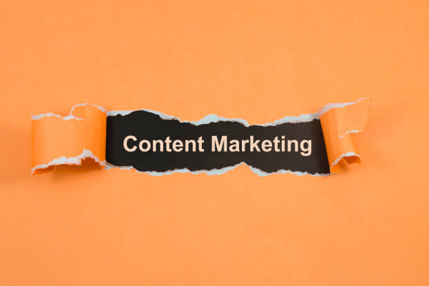 Content Marketing text on paper. Word Content Marketing on torn paper. Concept Image. stock photo