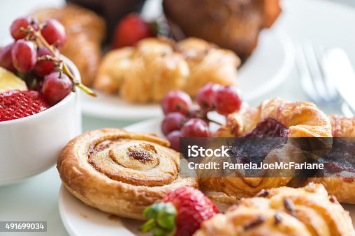 istock Continental Breakfast - Cinnamon Bun, Danishes, Rolls, Muffins, Fresh Fruit 491699034