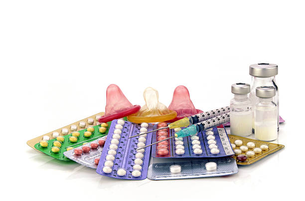 Contraception Education Concept. Contraception Education Concept with Oral contraceptive, Emergency Pills, Injection Contraceptive and Male Condom. contraceptive stock pictures, royalty-free photos & images