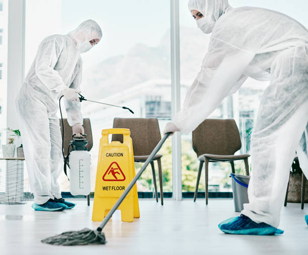 Control corona and keep it clean Shot of healthcare workers wearing hazmat suits and sanitising a room during an outbreak cleaner stock pictures, royalty-free photos & images