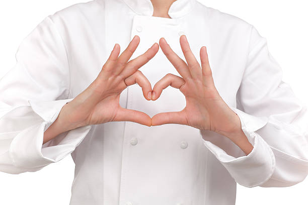 cook making a sign with both hands representing a heart stock photo