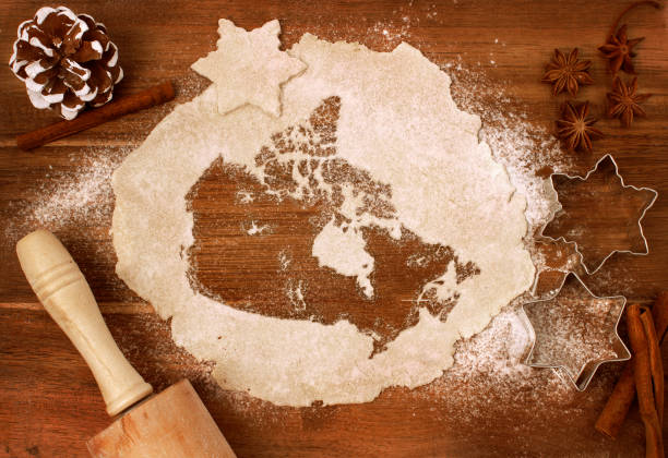 Cookie dough cut as the shape of Canada (series) Festive cookie dough with the shape of Canada cut out (series) spices of the world stock pictures, royalty-free photos & images