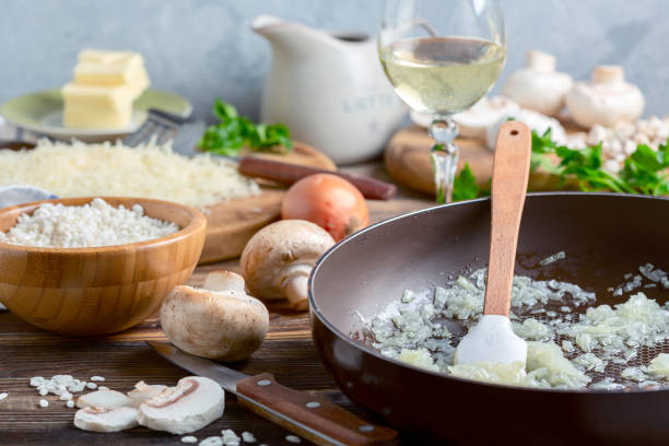Cooking risotto with mushrooms. stock photo