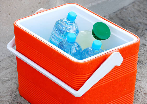 Cool box containing water bottles and juice stock photo