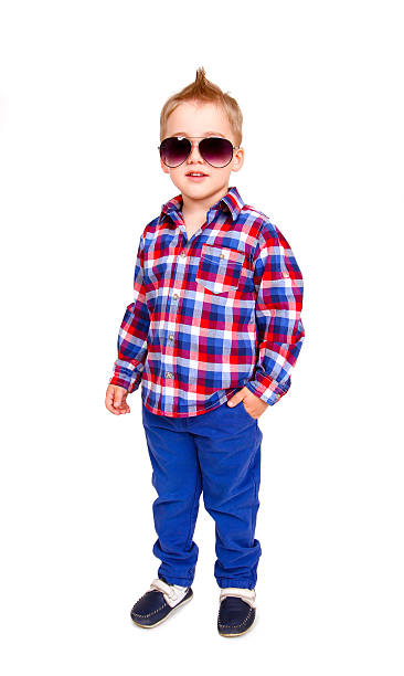Cool little boy posing on  white background stock photo