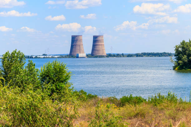Cooling towers of Zaporizhia Nuclear Power Station in Enerhodar, Ukraine Cooling towers of Zaporizhia Nuclear Power Station in Enerhodar, Ukraine zaporizhzhia stock pictures, royalty-free photos & images