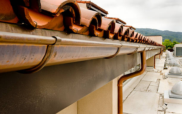 Copper Gutter with Tile Roof stock photo