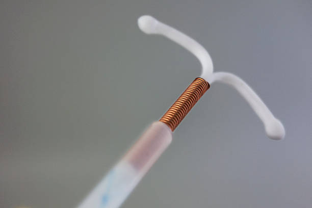 Copper IUD Copper Intrauterine device. contraceptive stock pictures, royalty-free photos & images