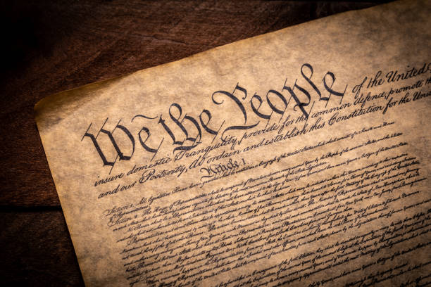 A copy of the constitution of the United States of America A copy of the Constitution of the United Sates of American on a wooden background declaration of independence stock pictures, royalty-free photos & images