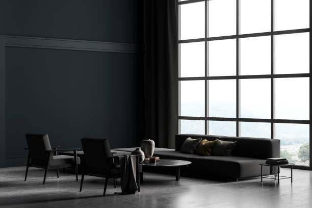 Copy space mockup wall in villa living room design interior, grey furniture on gray blue wall, concrete floor, armchair, couch with lamp. Concept of relax. Panoramic window. stock photo