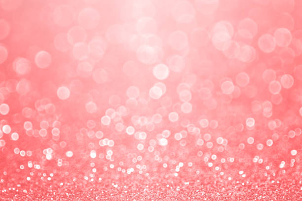 Coral Pink and Peach Glitter Sparkle Background stock photo