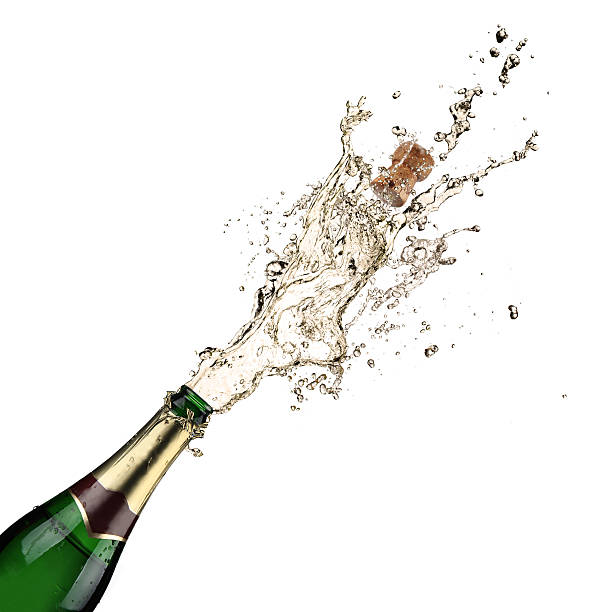 A cork being popped on a champagne bottle stock photo