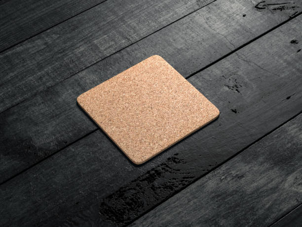 Cork pad, beer coaster Mockup on the wooden table Cork pad, beer coaster Mockup on the wooden table. 3d rendering coaster stock pictures, royalty-free photos & images