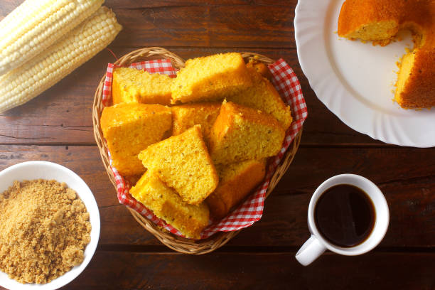 corn cake sliced in basket on rustic wooden table for breakfast. Typical Brazilian food. stock photo