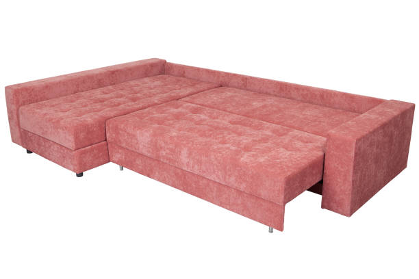 Corner sectional sofa-bed of pink, queen size,  isolated on a white background. 