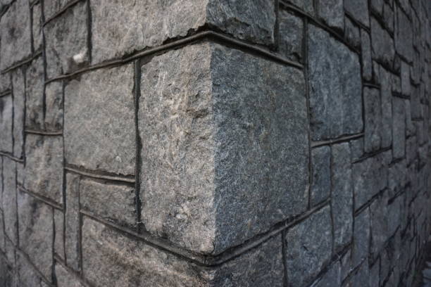 Corner stone Granite stone blocks forming a corner stable stock pictures, royalty-free photos & images