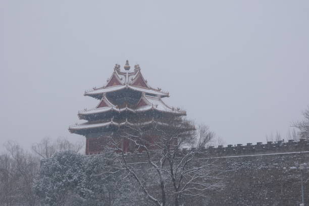 Corner Tower is covered with snow, Forbidden City, China, Beijing. stock photo