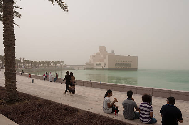 corniche and mia in a sandstorm, doha, qatar - fifa 2022 個照片及圖片檔