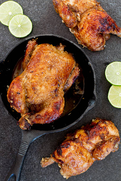 cornish hen with limes stock photo