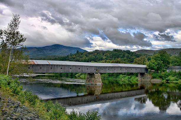 Cornish-Windsor Bridge Covered bridge spanning the Connecticut River, connecting Vermont and New Hampshire. covered bridge stock pictures, royalty-free photos & images