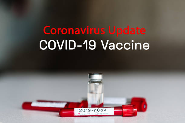 Coronavirus update, Covid-19 vaccine. Biological blood samples in test tubes and vaccine for the disease on a white background. 2019-nCov. Laboratory test - positive result. Blood is infected. stock photo