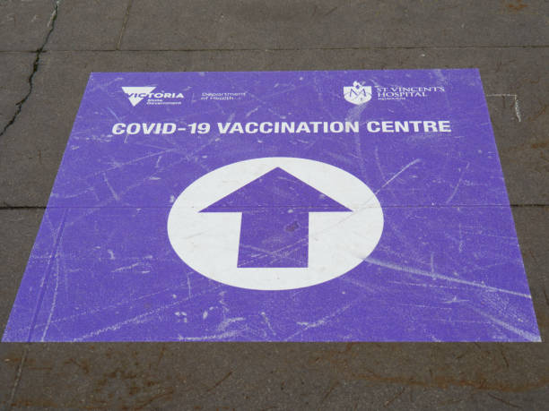 Coronavirus vaccination sign and arrow stock photo