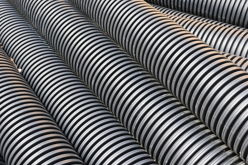 Close up of corrugated black hose pipes