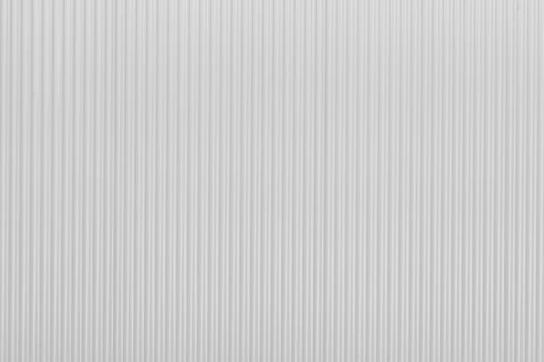 Corrugated new white zinc metal wall of fence as textured and background stock photo