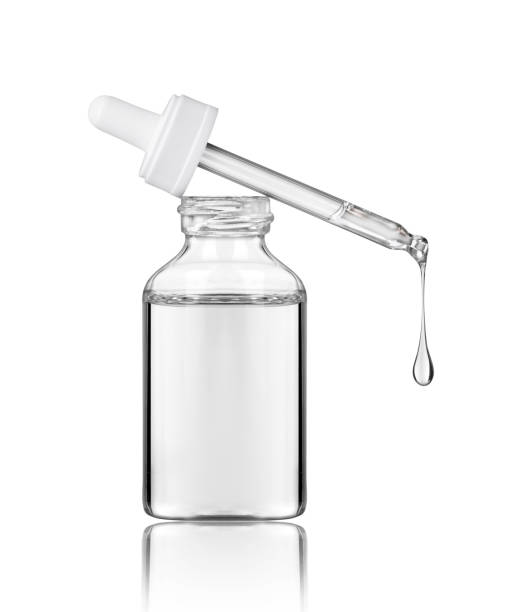 Cosmetic bottle with pipette on white background Cosmetic bottle with pipette on white background pipette stock pictures, royalty-free photos & images