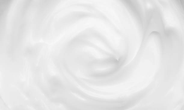 Cosmetic cream texture background. White surface cosmetic cream for skin and body in an open jar stock photo