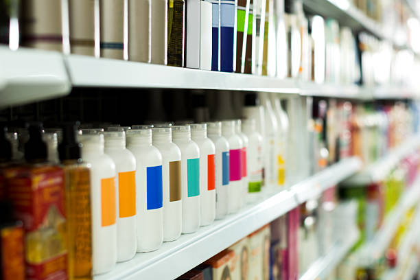Cosmetic section with conditioners Cosmetic section with conditioners, shampoo and hair treatment in store products stock pictures, royalty-free photos & images